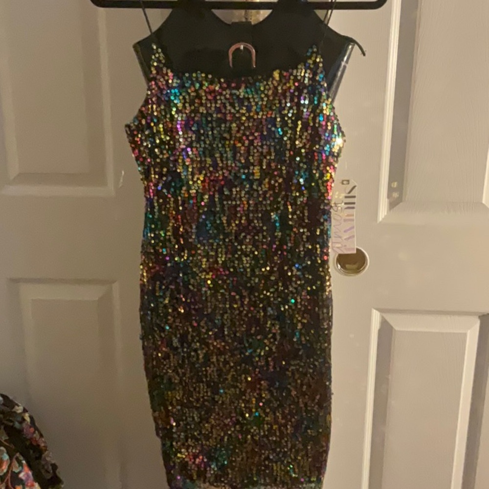 Black sequence dress, gold zippers, gold in the sequence with multicolors,